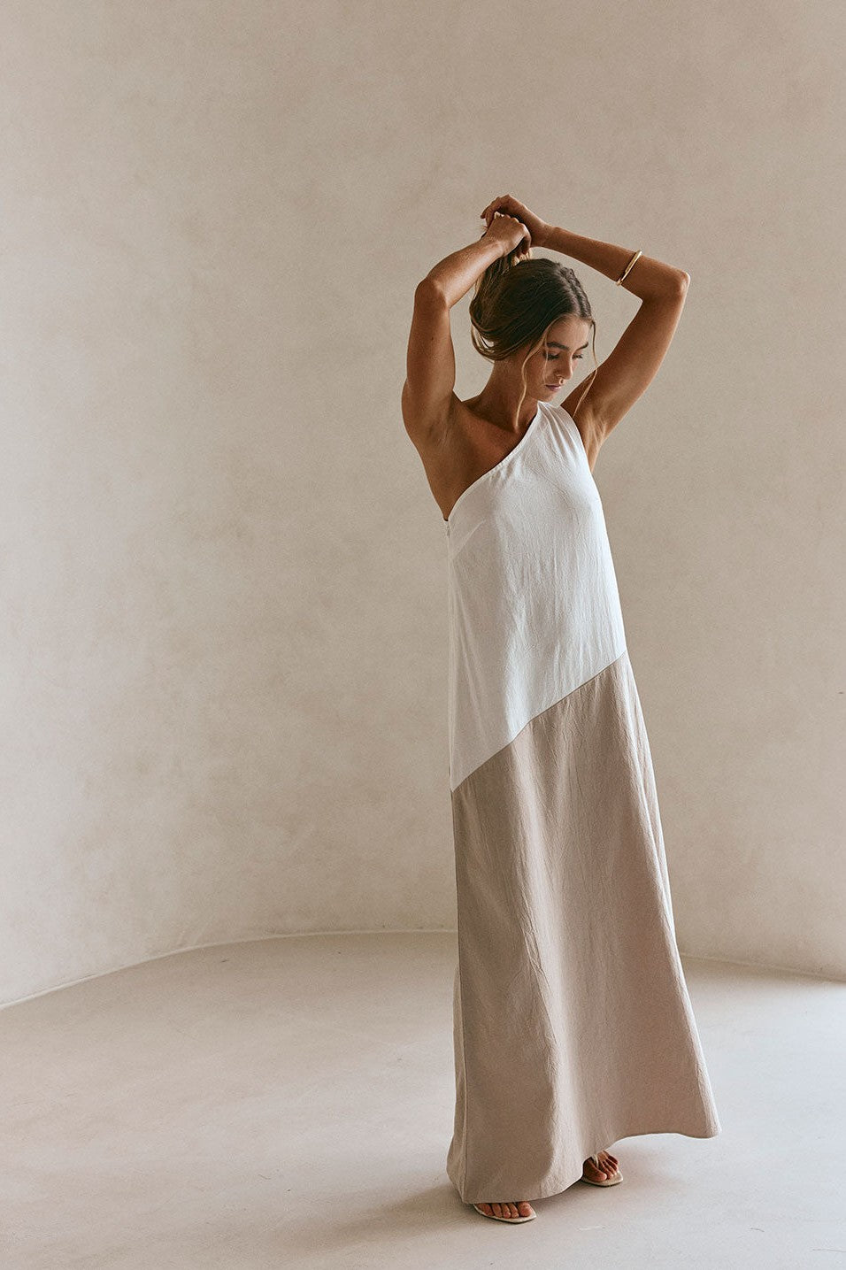 Beige maxi dress with an A-line skirt, back view
