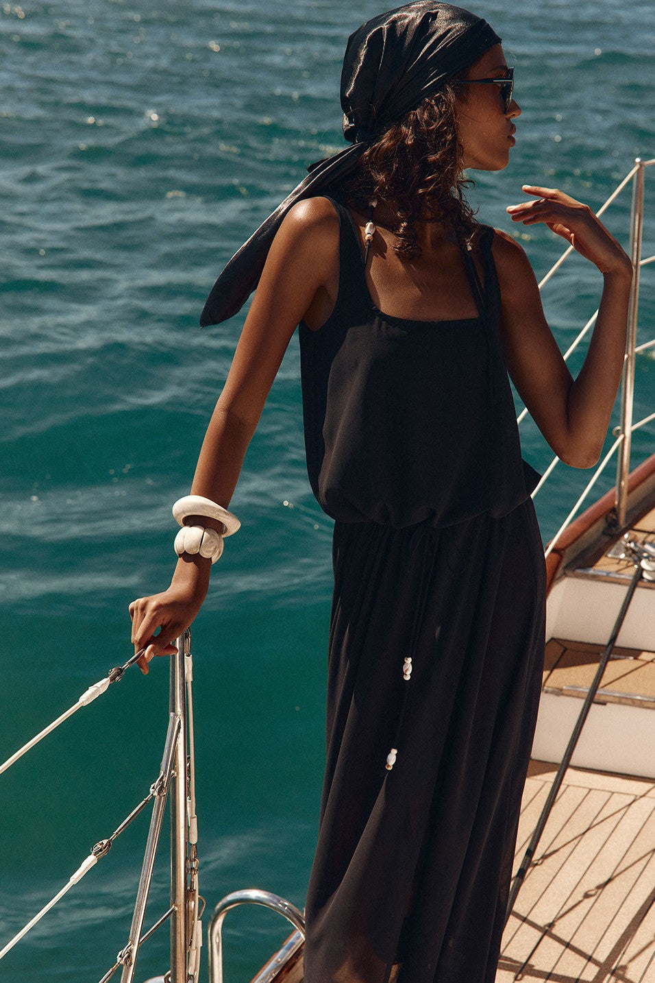 Black maxi dress with a halter neckline, back view
