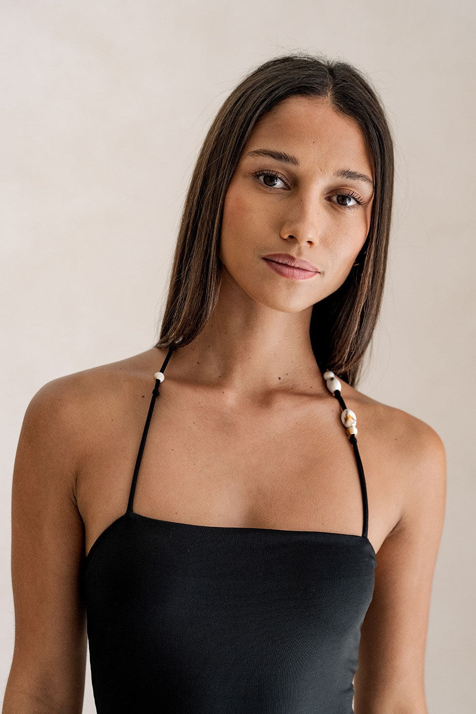 Black maxi dress with a halter neckline, side view