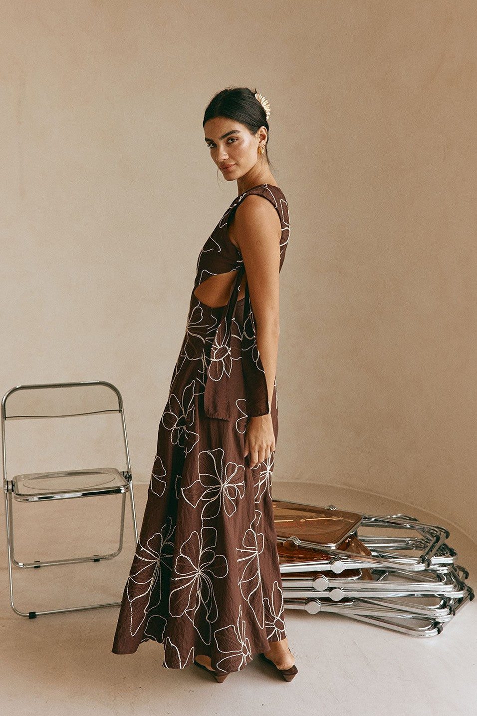 Brown maxi dress with an A-line skirt, styled on model