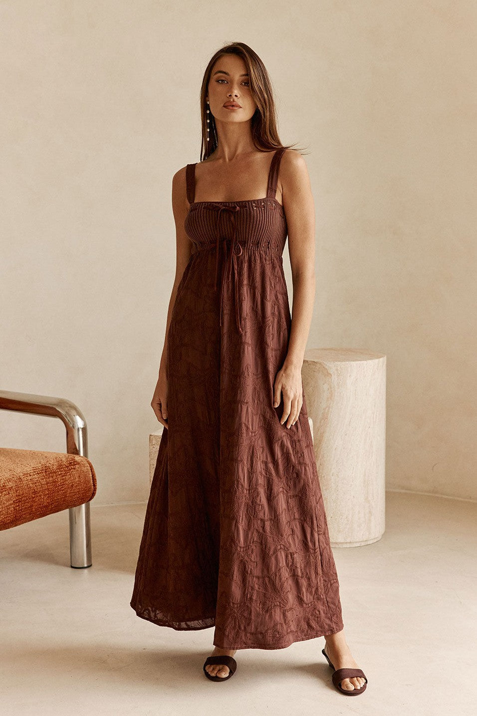 Brown maxi dress with an A-line skirt, side view