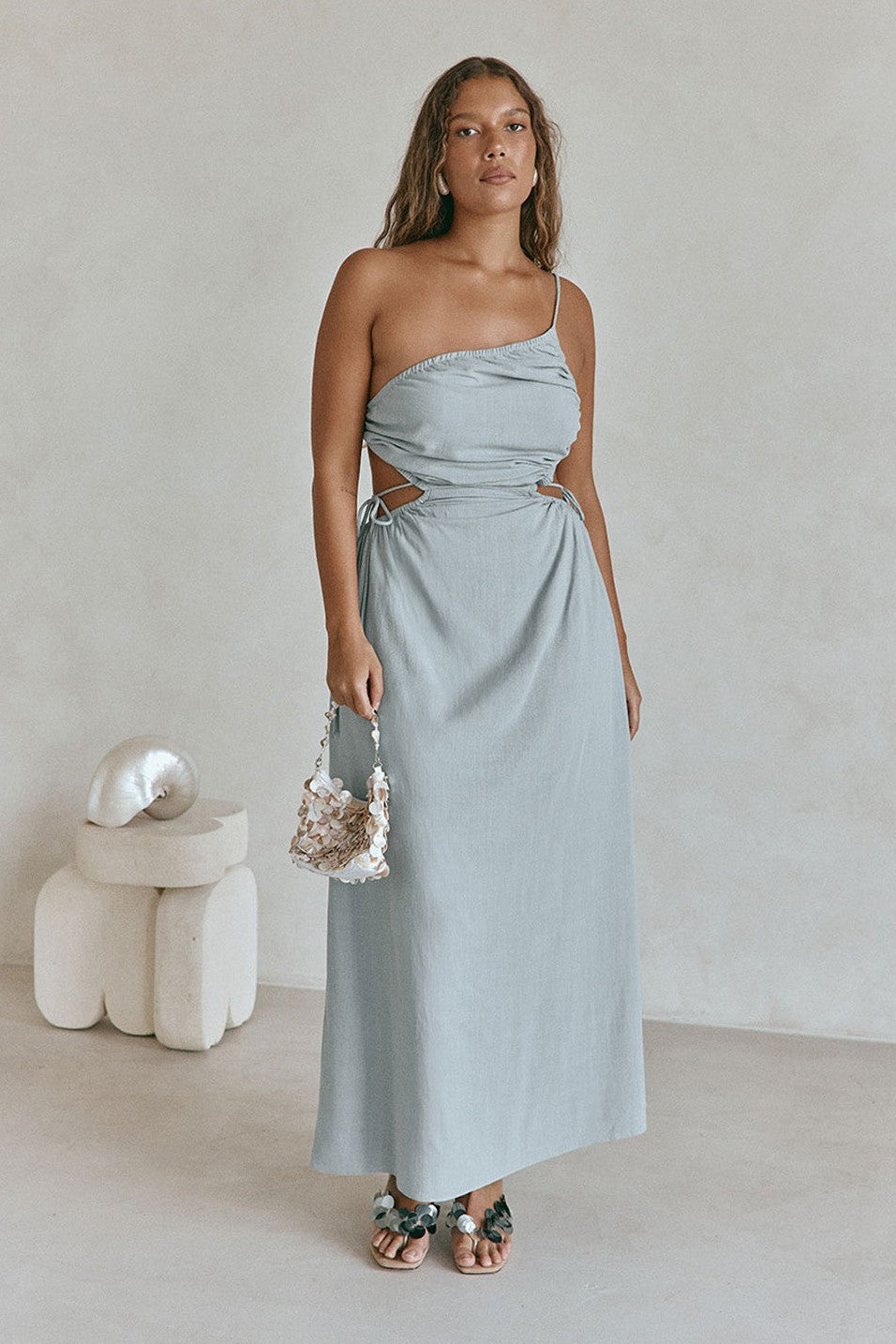 Blue maxi dress with an open back, front view
