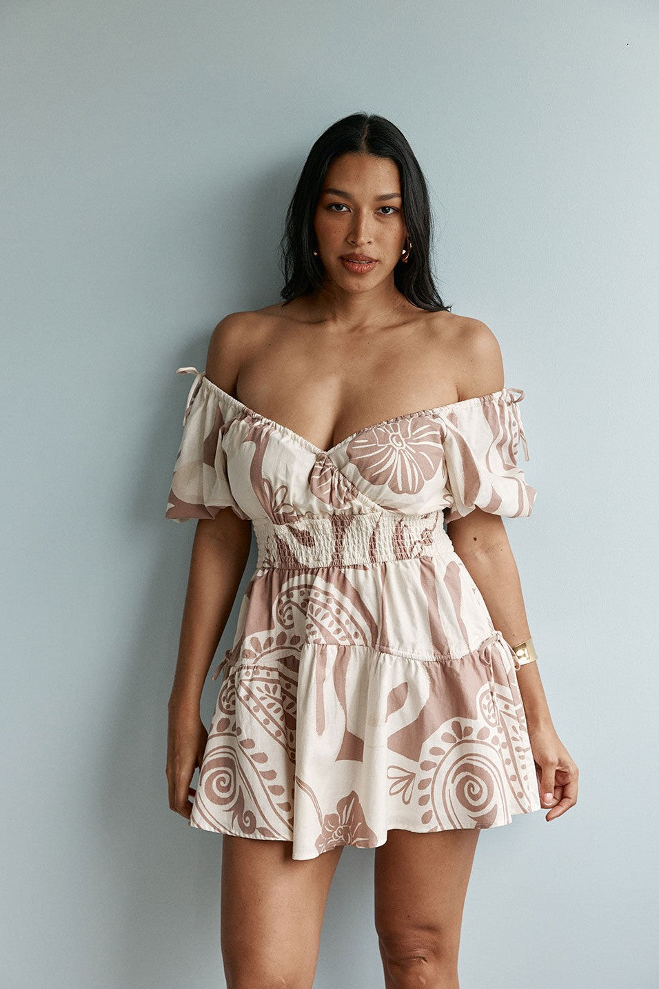 Beige mini dress with shirred detailing, back view