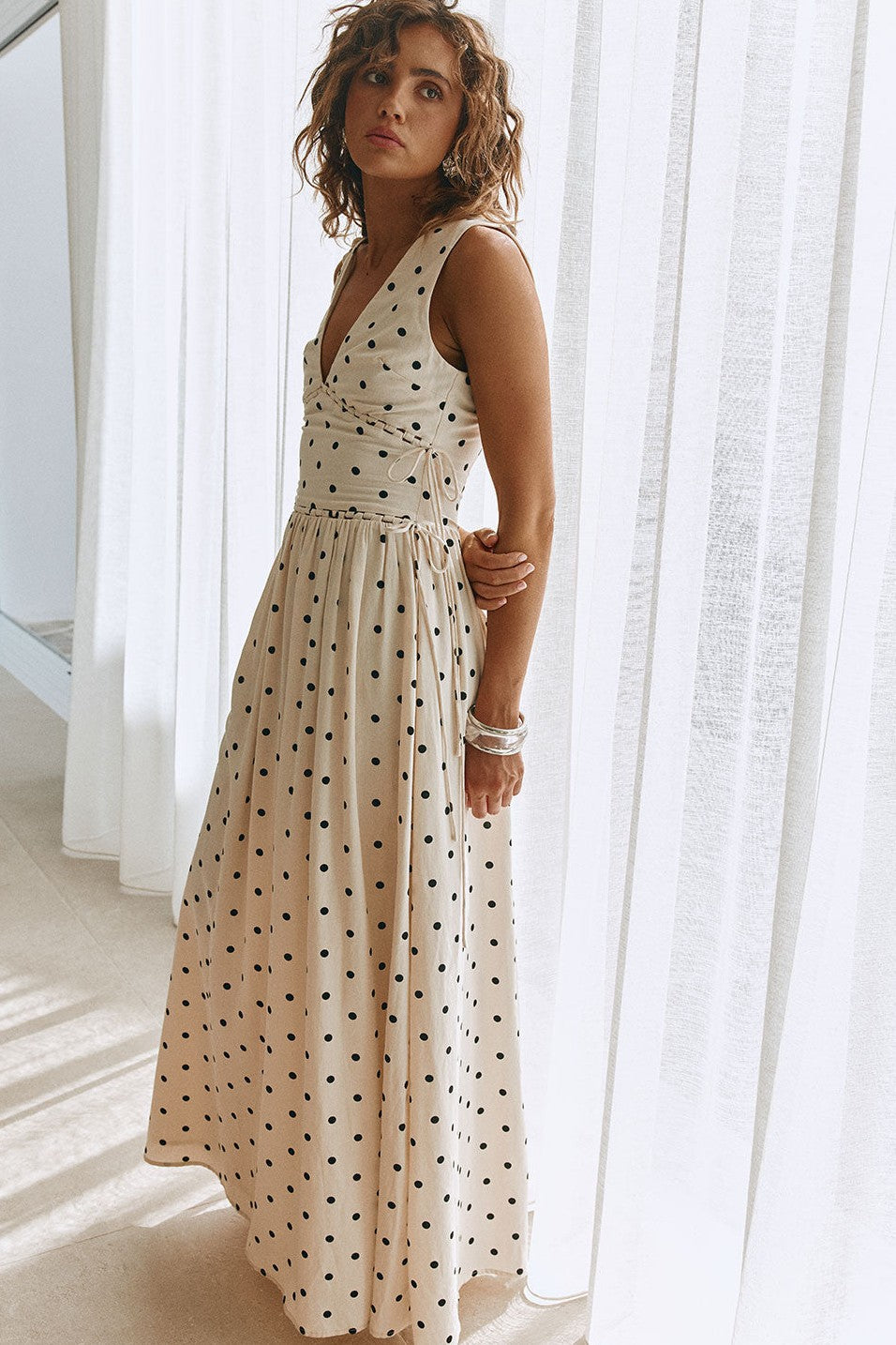 Cream maxi dress with a plunging V neckline, front view