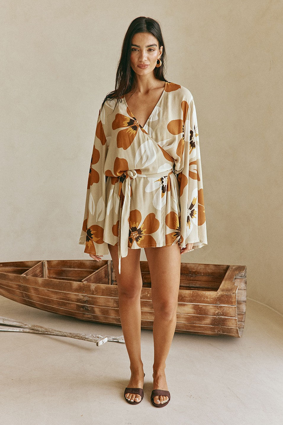 Orange mini dress with a wrap silhouette, detail view