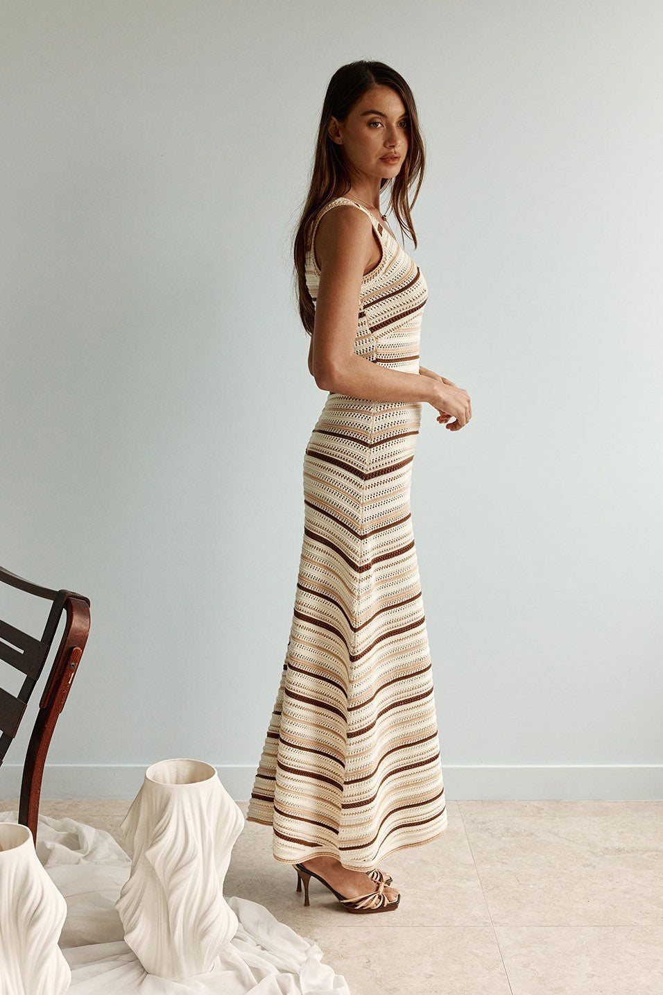 Cream maxi dress with a V neckline, styled on model