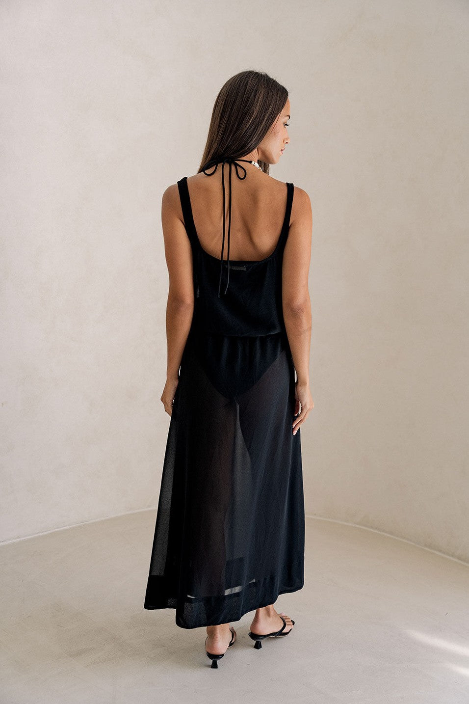 Black maxi dress with a halter neckline, detail view