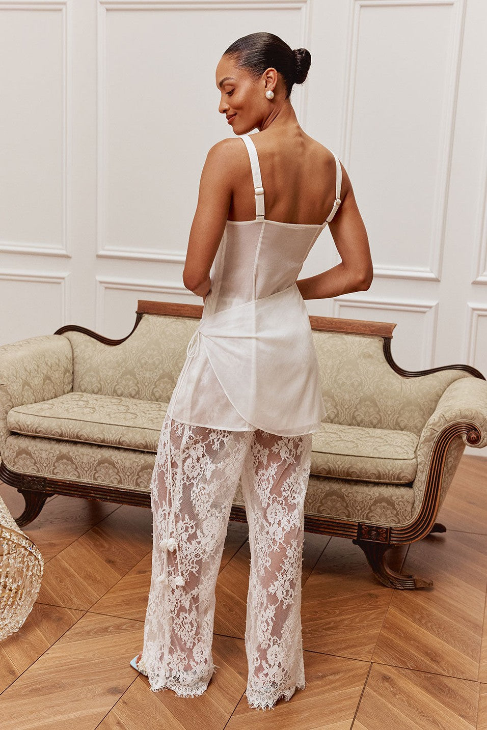 White midi dress with a wrap silhouette, side view