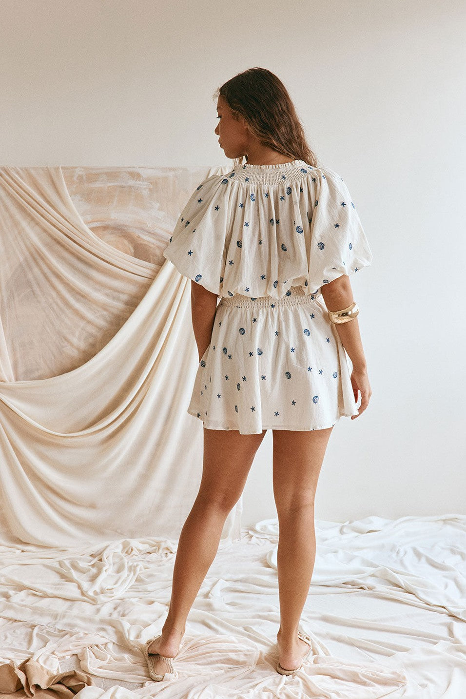 Cream mini dress with shirred detailing, front view