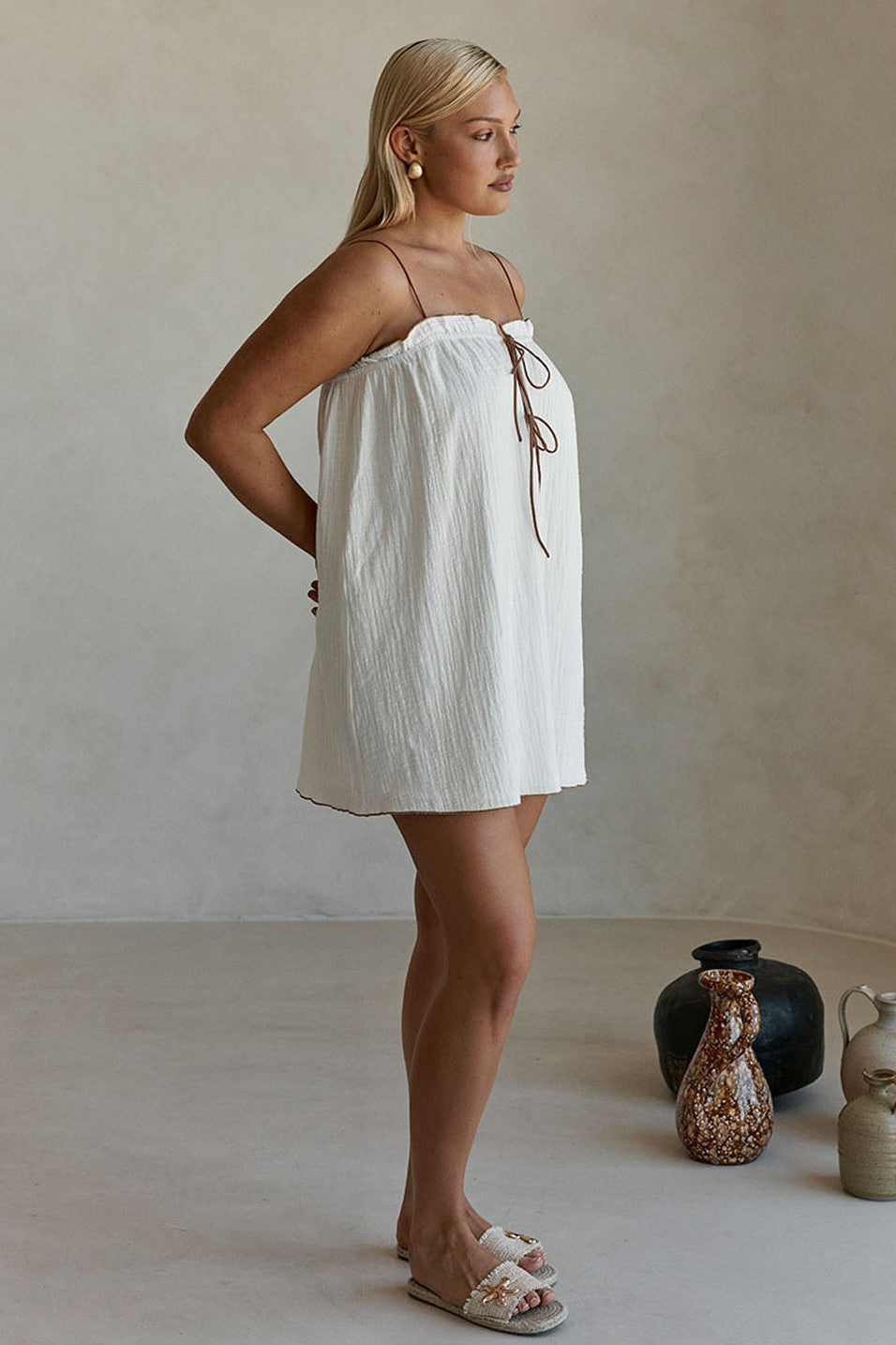 White mini dress, styled on model