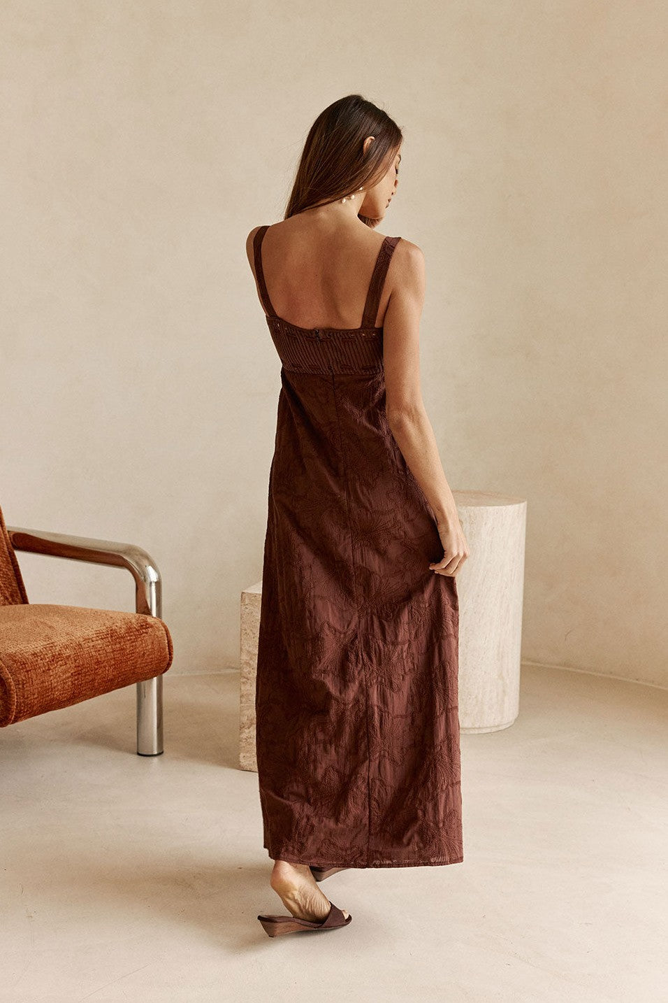Brown maxi dress with an A-line skirt, styled on model