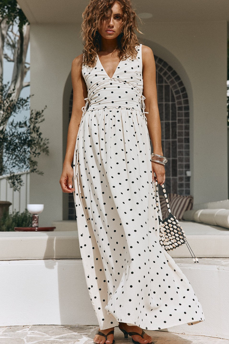 Cream maxi dress with a plunging V neckline, front view