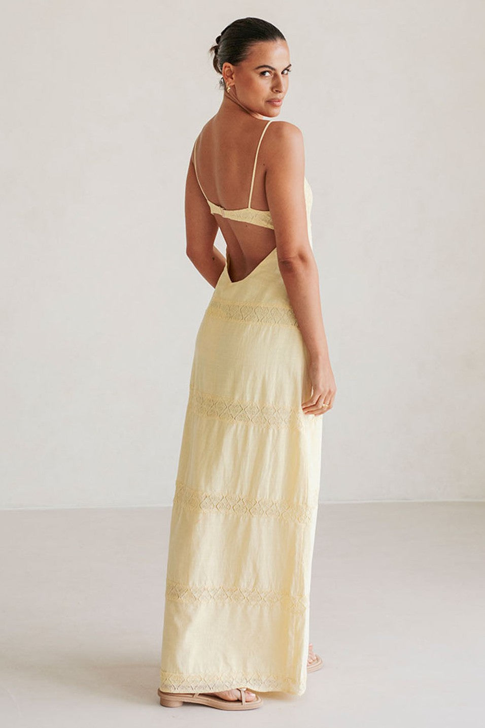 Yellow maxi dress with a round neckline, front view