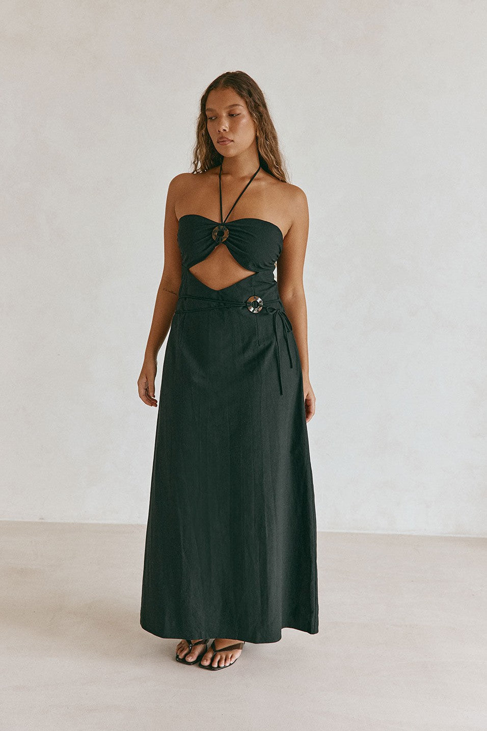 Black maxi dress with a strapless neckline, back view
