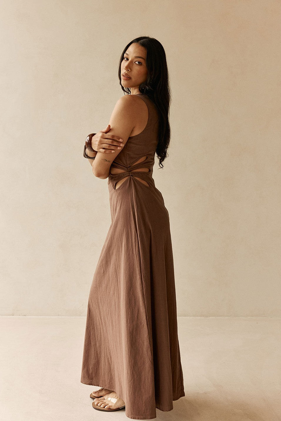 Brown maxi dress with a V neckline, back view