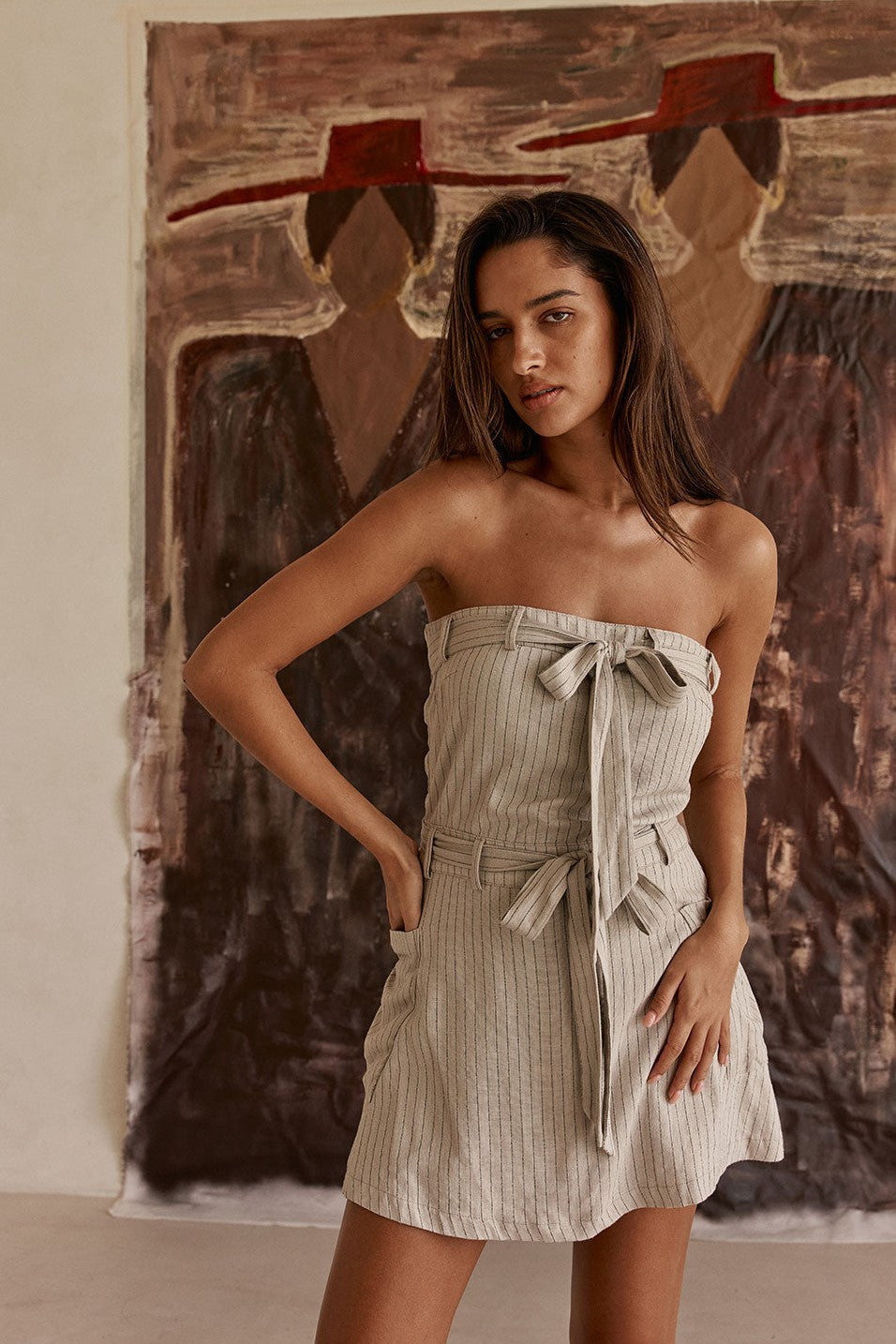 Grey mini dress with a strapless neckline, front view