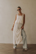 Beige maxi dress with a halter neckline, front view