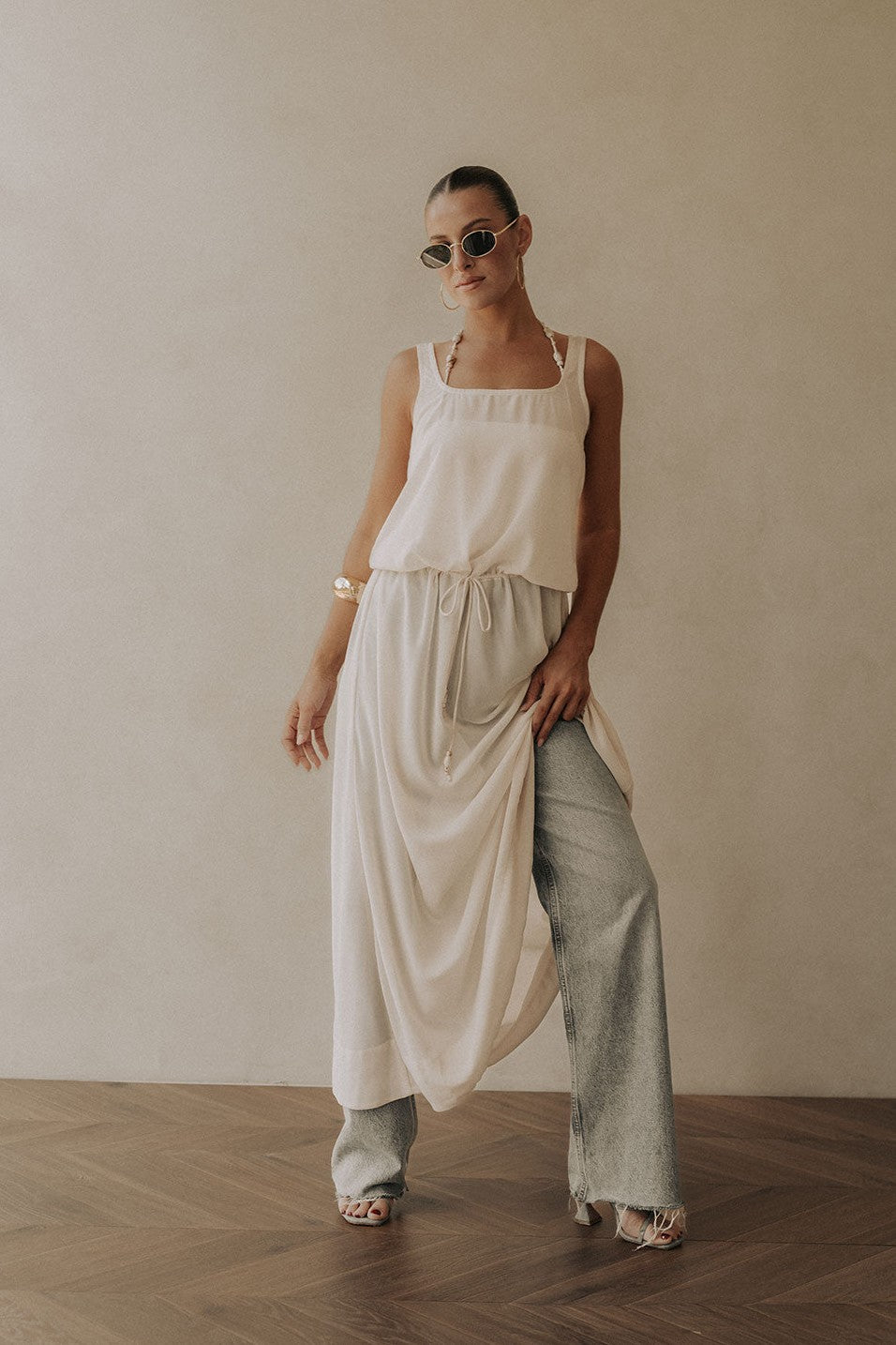 Beige maxi dress with a halter neckline, front view
