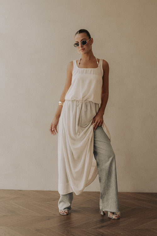 Beige maxi dress with a halter neckline, front view