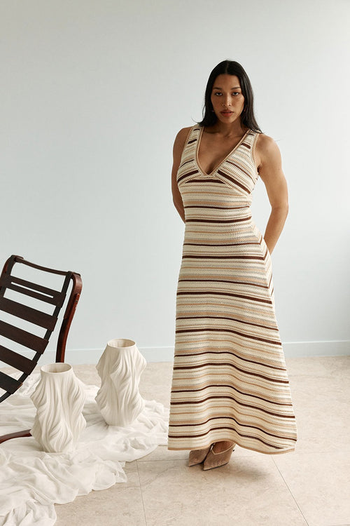 Cream maxi dress with a V neckline, back view
