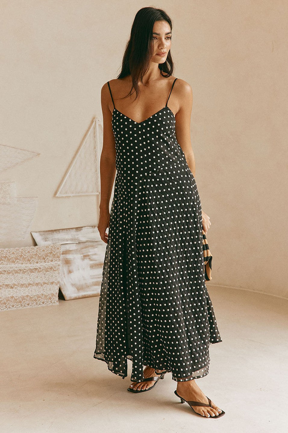 Black maxi dress with a V neckline, side view